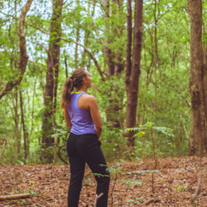 woman unwinding on retreat in the rainforest having downtime